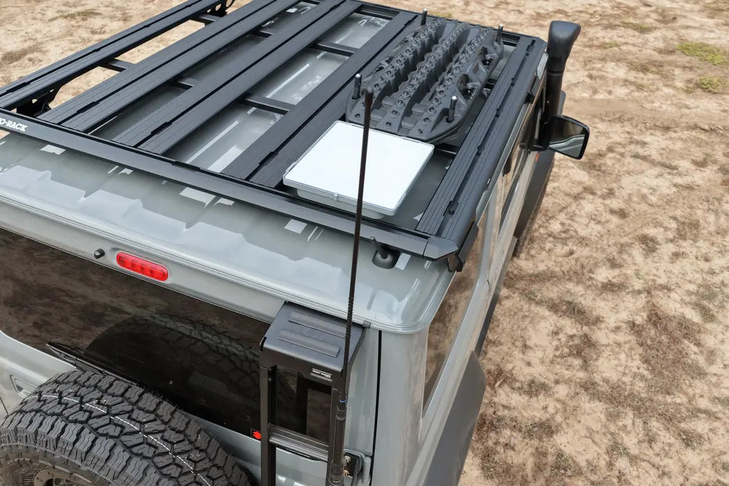 Roof rack system on a vehicle with a textured ground background