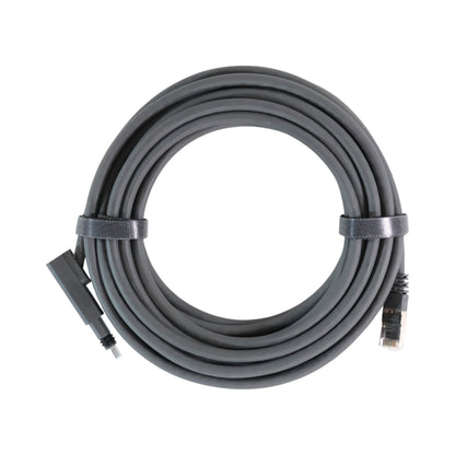 Starlink Gen 2 SPX to RJ45 20ft adapter cable coiled on table