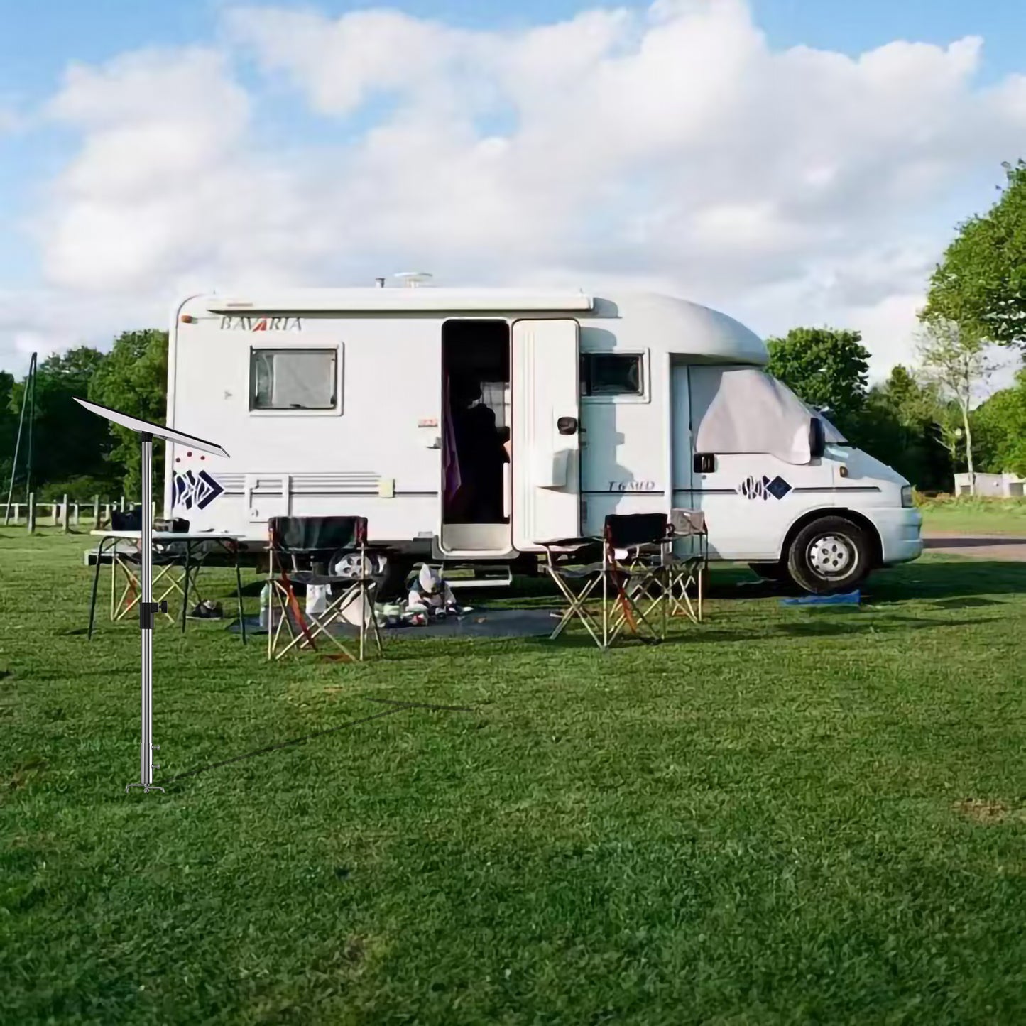 Starlink portable ground mount stand used beside campervan