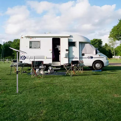 Starlink portable ground mount stand used beside campervan