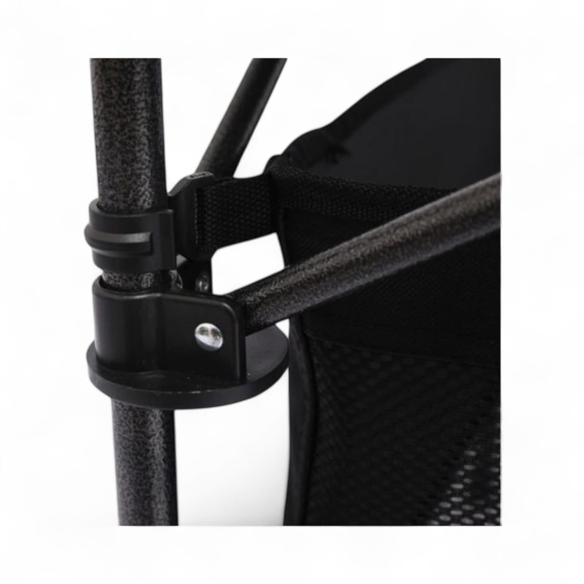 Close-up of a black mesh chair with a strap and metal clip on a white background