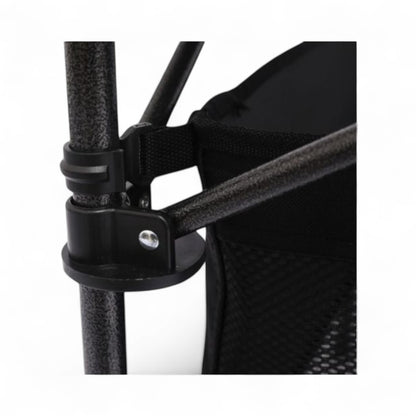Close-up of a black mesh chair with a strap and metal clip on a white background