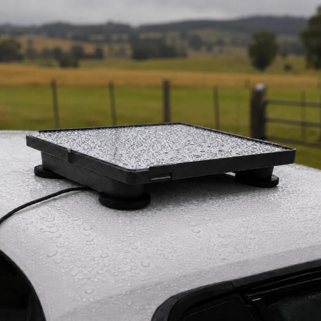 Aluminium Mount a car roof with a rural landscape in the background